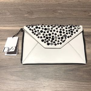 Diane Von Furstenbeg white leather clutch with black stud detail